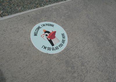 Pierre welcomes you with a floor sticker at CMOG